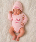 Baby Girls She's Here Long Sleeved Knitted Romper And Beanie